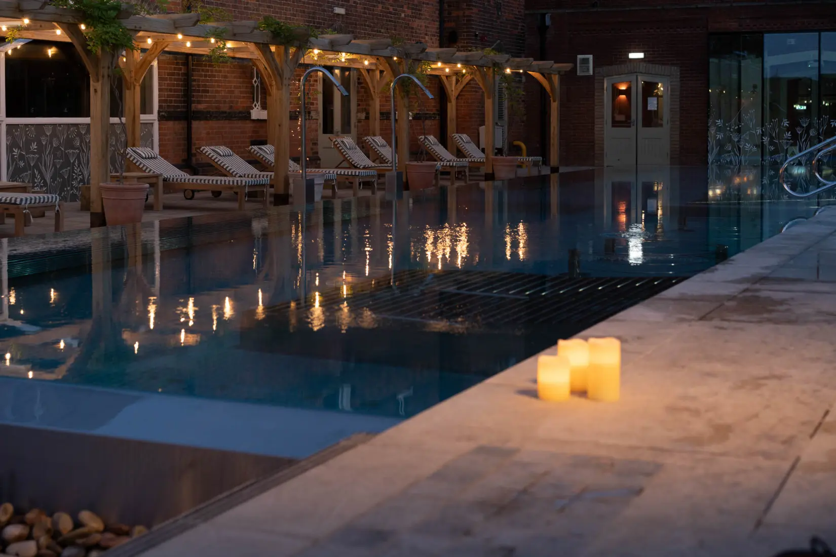 An image of the outside pool in the evening at Eden Hall