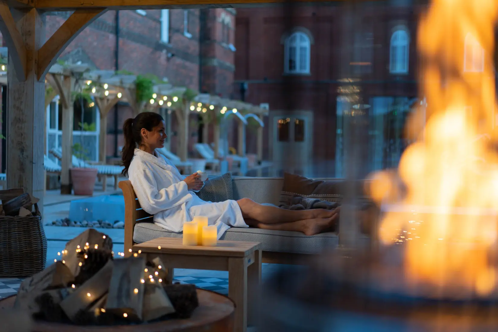 An image of a women at the outside pool in the evening at Eden Hall