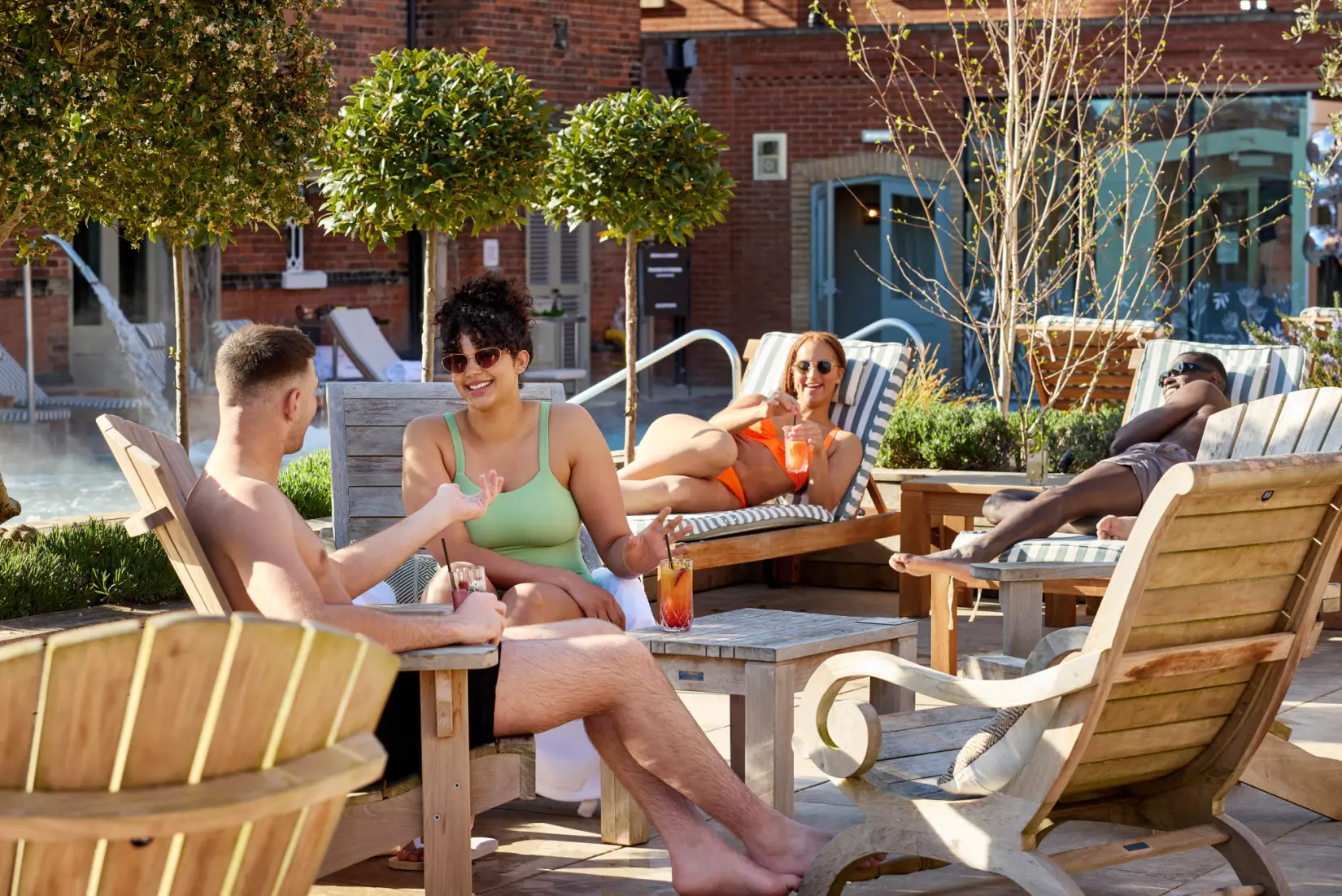 An image of a group on the sun loungers at Eden Hall