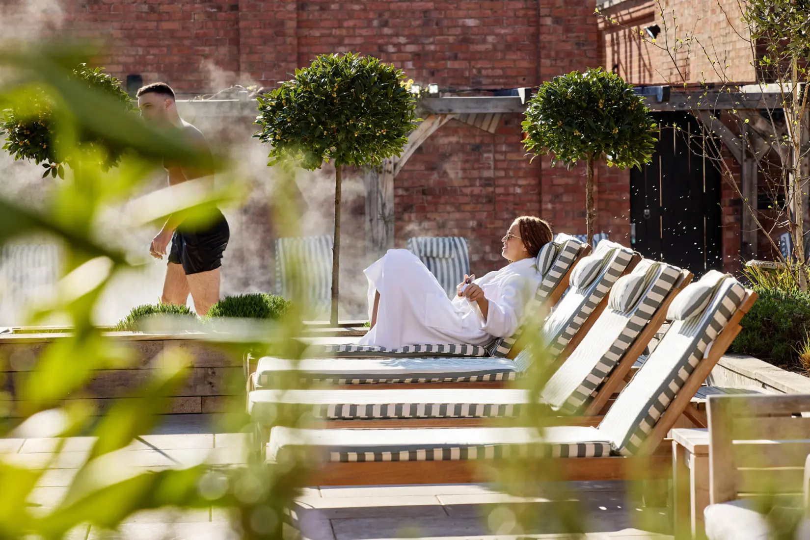 An image of a woman on the sun loungers at Eden Hall