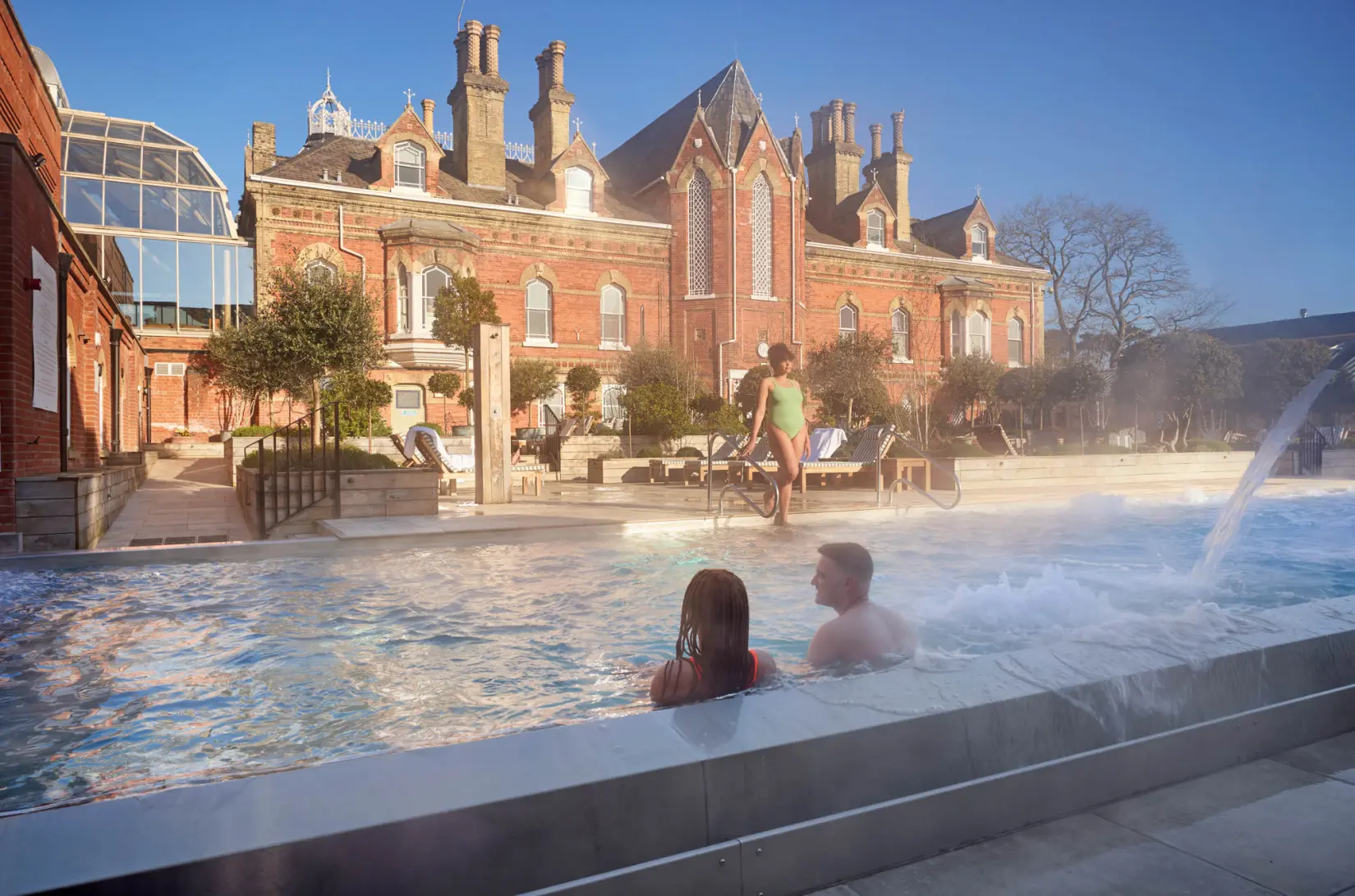 An image of people in the outdoor pool at Eden Hall