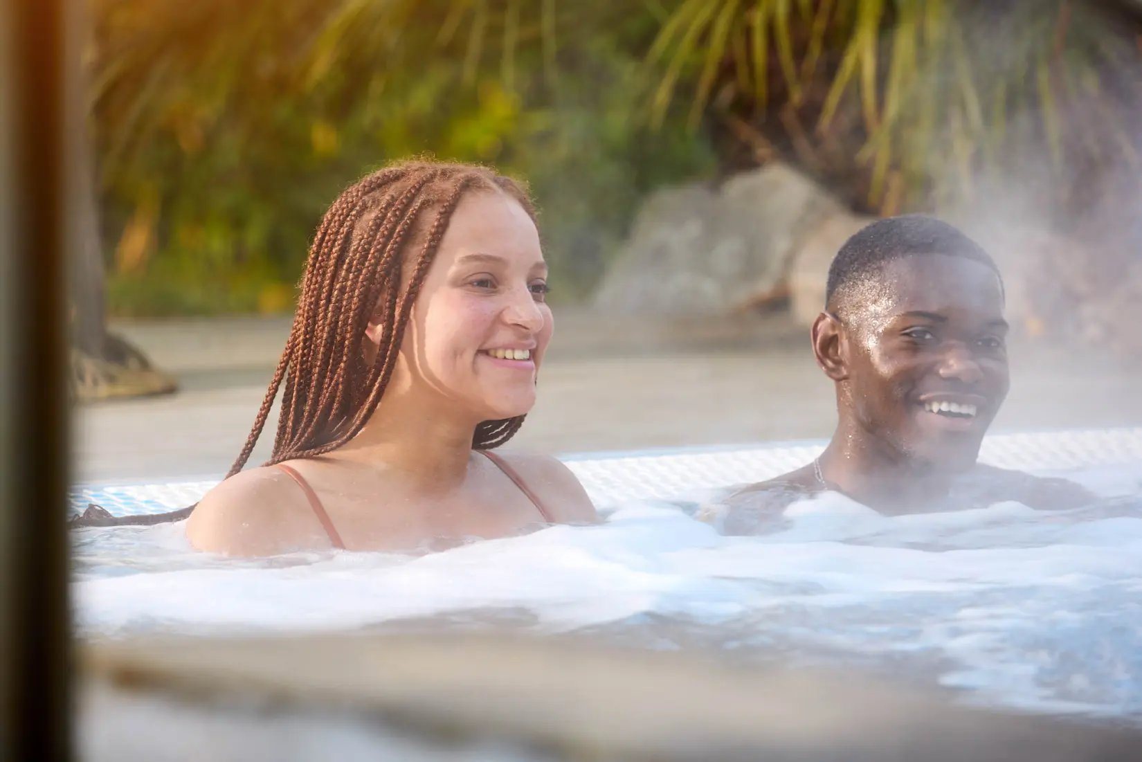 An image of two people in the outside pool at Eden Hall