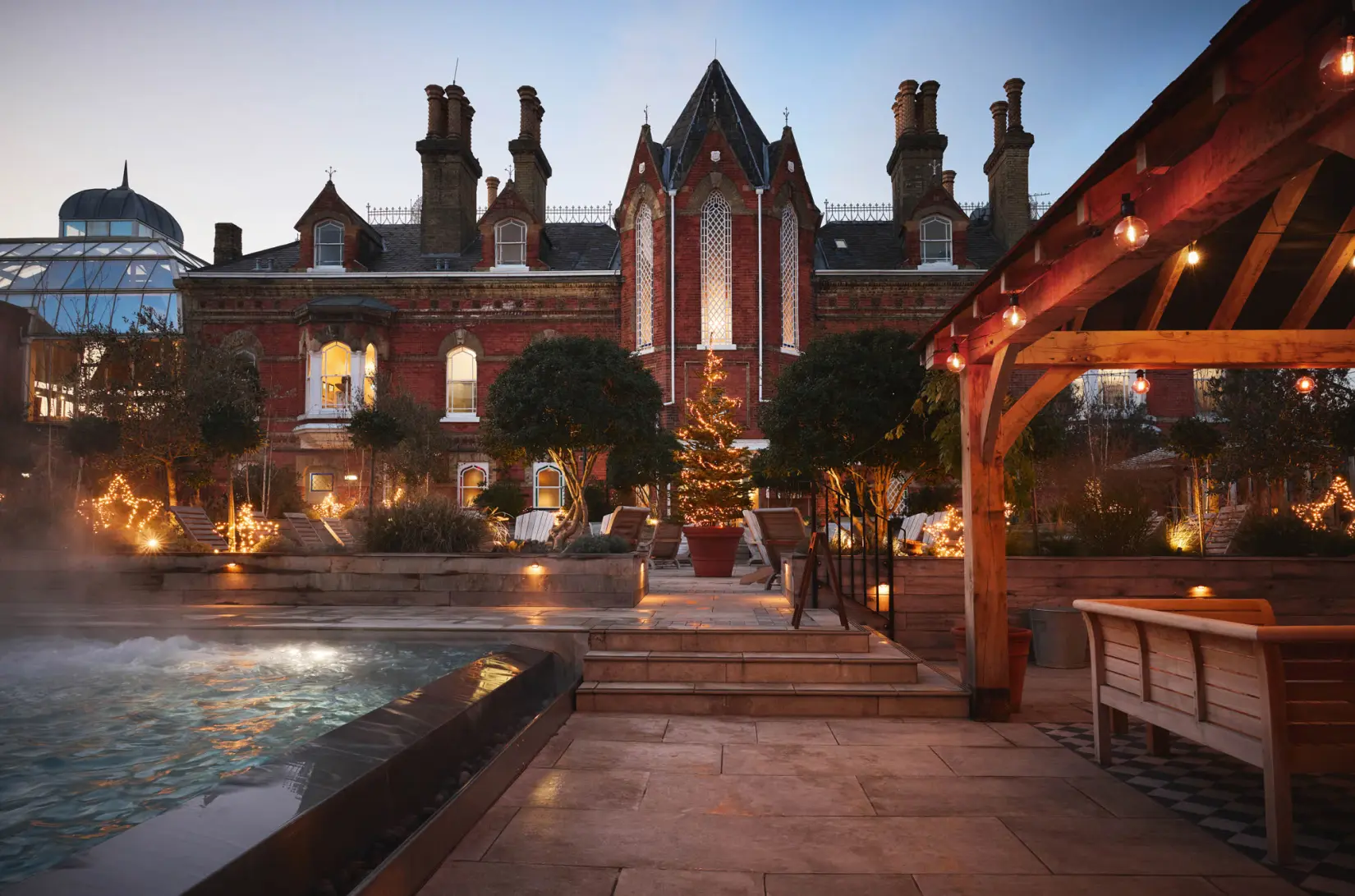 An image of the outdoor pool decorated at Christmas time at Eden Hall
