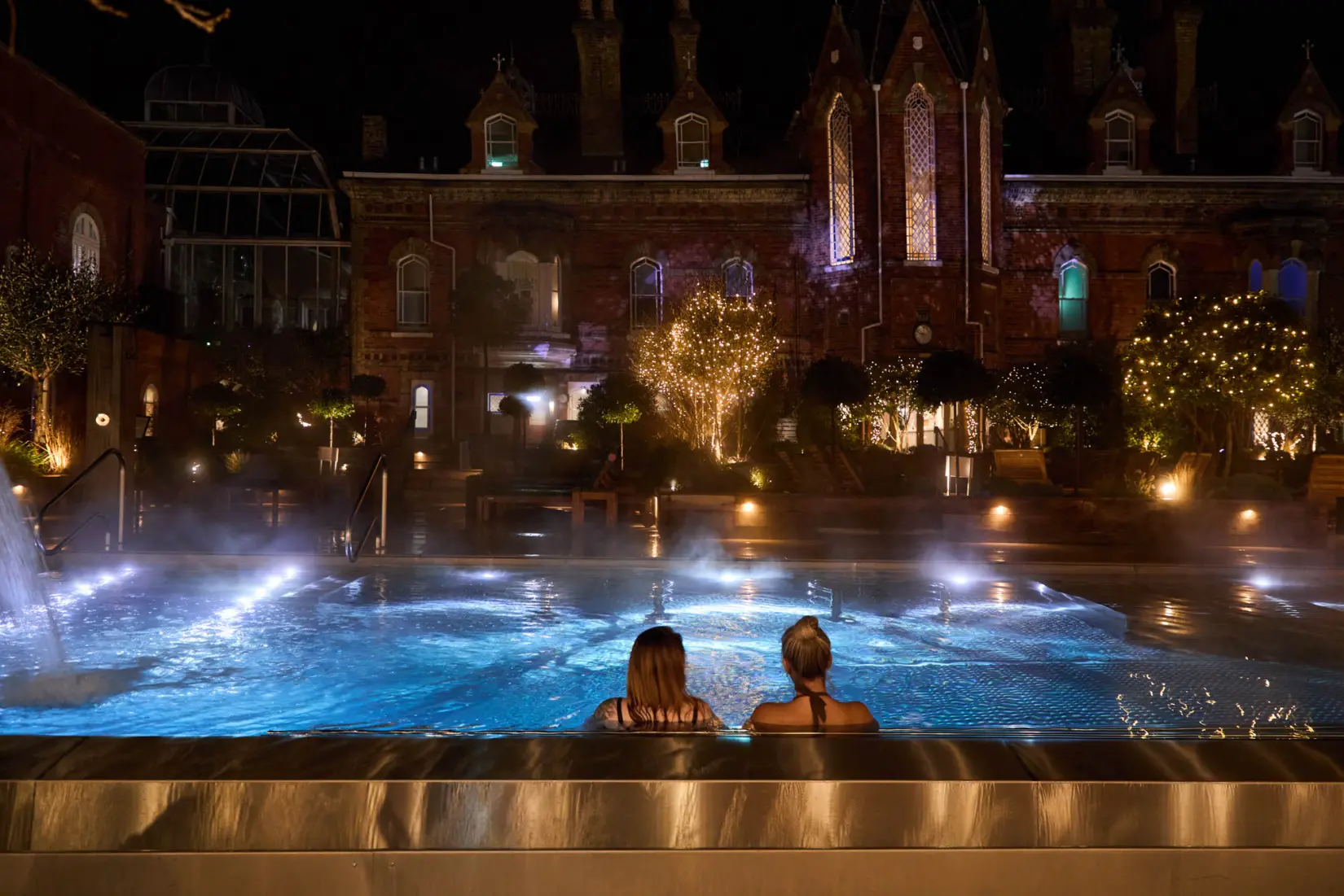 An image of one of the outdoor pools at night at Eden Hall