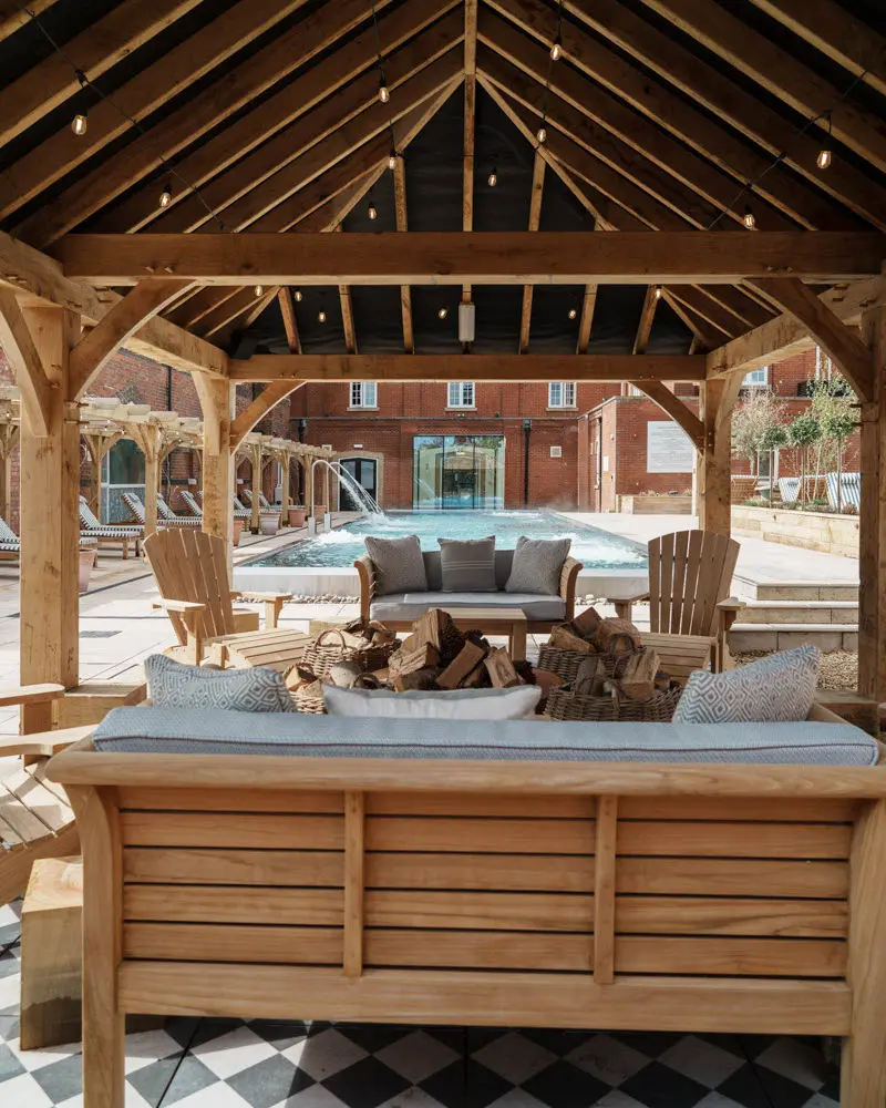 An image of the outdoor pool seating area at Eden Hall