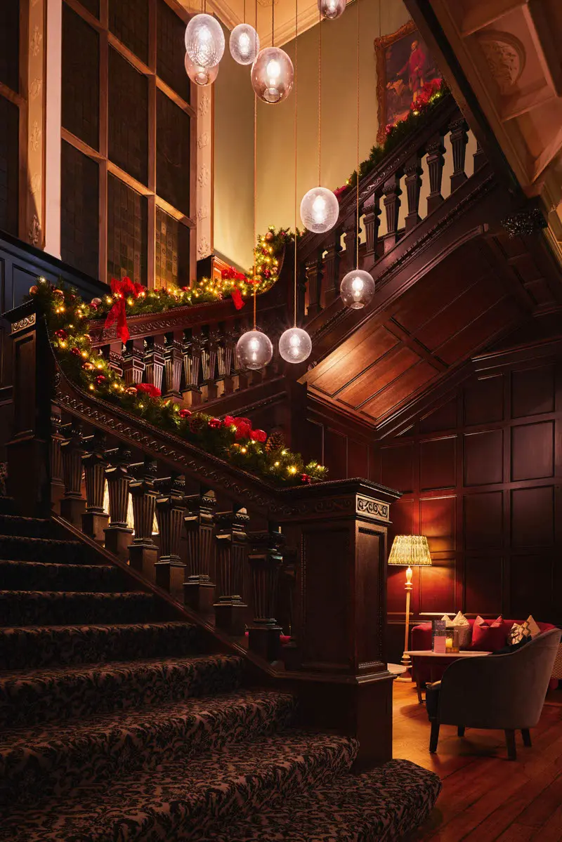 An image of a decorated stairway at Hoar Cross Hall