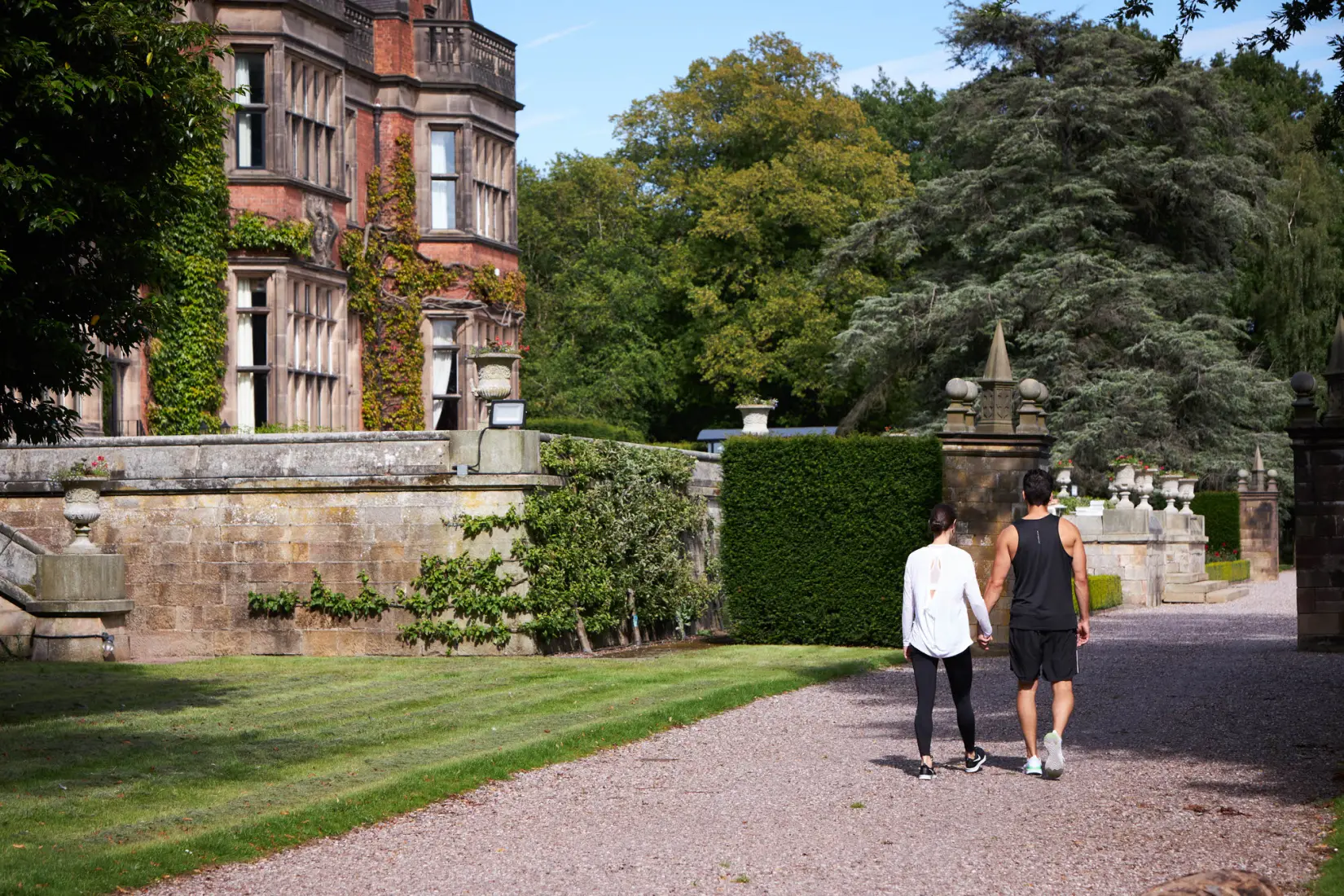 An image of a couple walking around outside at Hoar Cross Hall