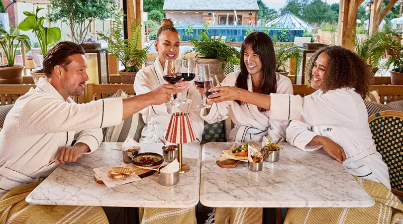 Image of four guests enjoying wine and snack on The Spa Terrace at Hoar Cross Hall
