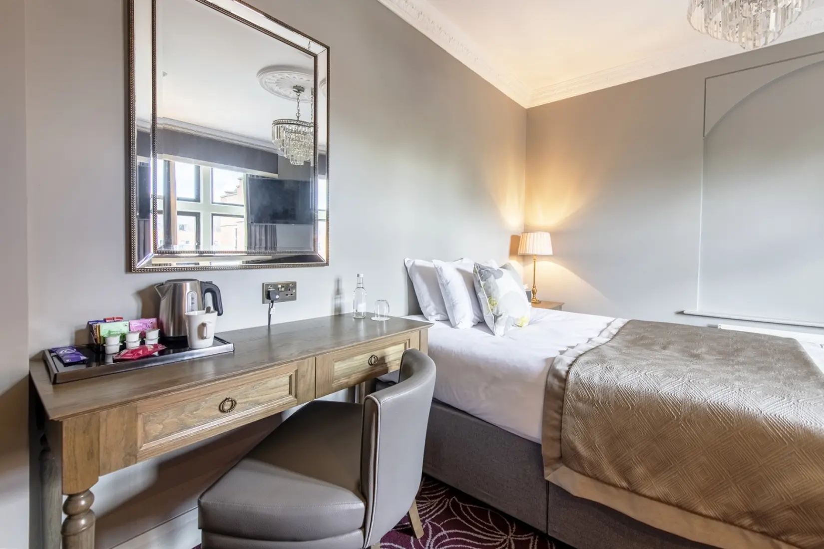 Snug room at Hoar Cross Hall with a plush bed, soft furnishings, and classic décor.