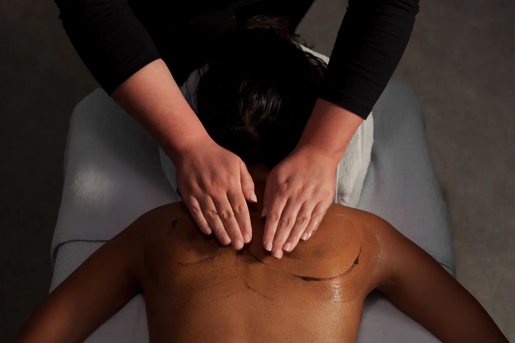Image of guest experiencing a Grown Alchemist Body Polish Treatment