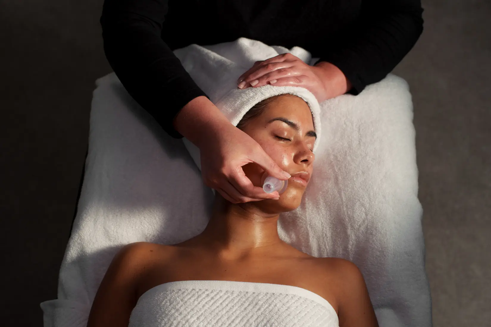 Image of guest experiencing facial cupping