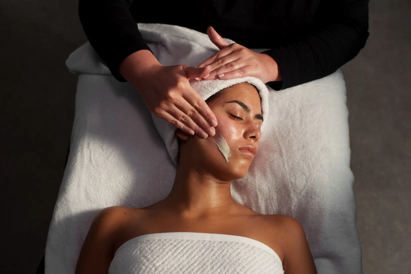 Guest receiving a Grown Alchemist facial