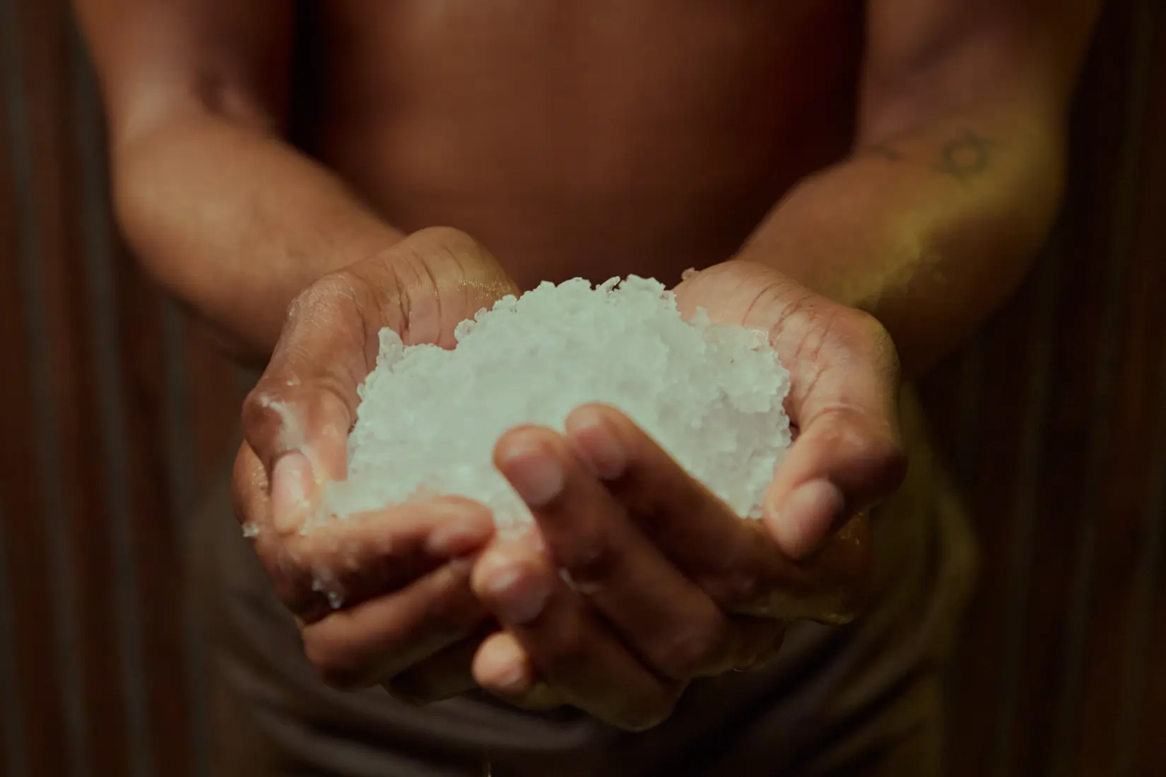 Hands holding ice